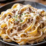 creamy beef and garlic butter pasta served hot